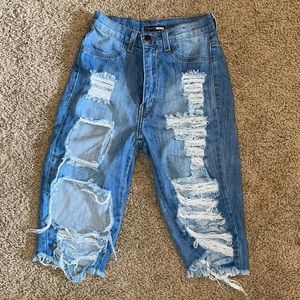 Fashion nova distressed jean shorts.
